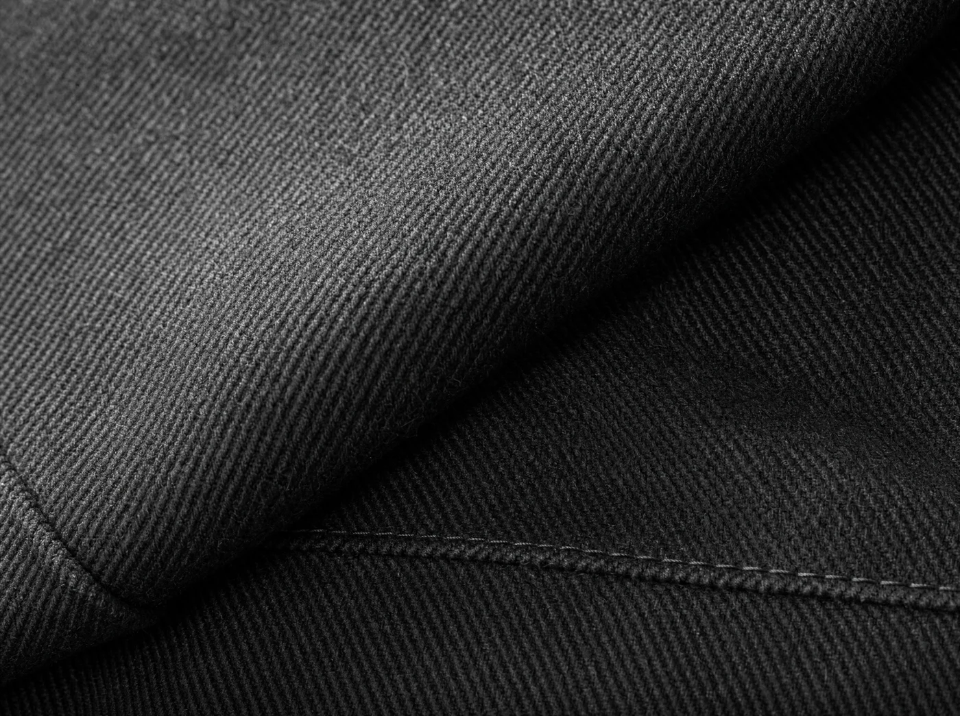 A close study of charcoal fabric and a precise stitched seam